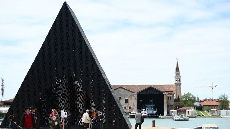 Visitors look at the installation "KwaeE" by Adjaye Associated at the 18th International Architecture Exhibition in Venice on May 18, 2023, during a press day. The Biennale, entitled "The Laboratory of the Future ", curated by Ghanaian-Scottish architect, educator, and novelist Lesley Lokko, will open on May 20 and will run until November 26, 2023 in the Arsenal gardens.