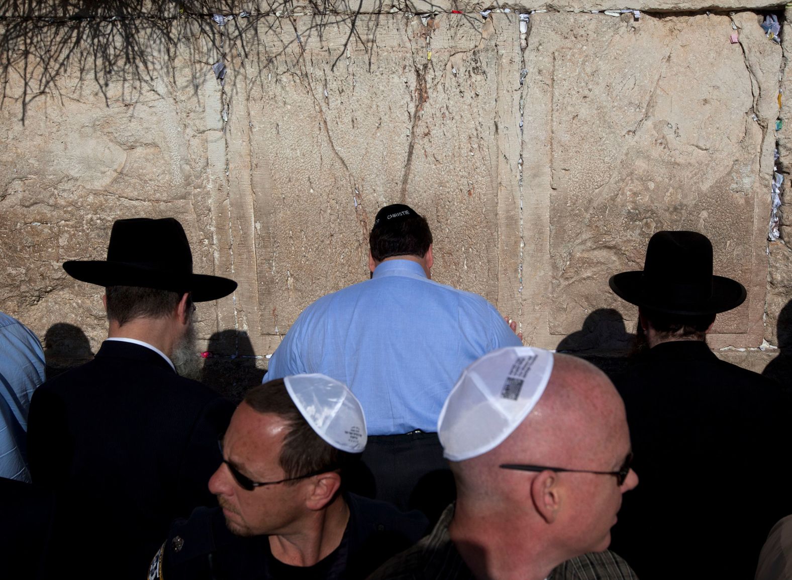 Christie, center, touches the Western Wall in Jerusalem in April 2012. He was on his first official overseas trip as governor.