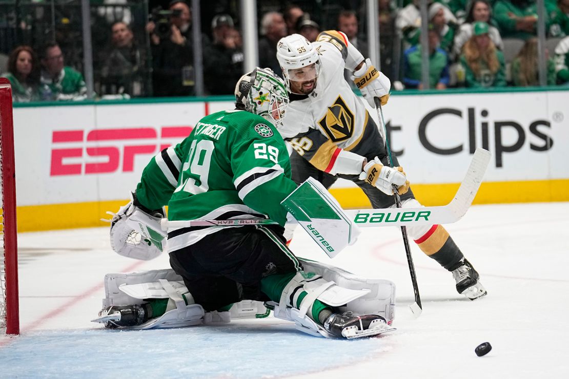 The Dallas Stars' Jake Oettinger defends as Vegas' Keegan Kolesar makes a pass during Game 6 of the NHL Western Conference Final.