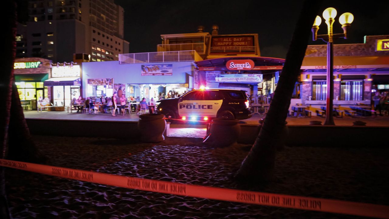 Hollywood Police cordon off the scene after an altercation ended in gunfire at the Hollywood Beach Broadwalk Monday night.