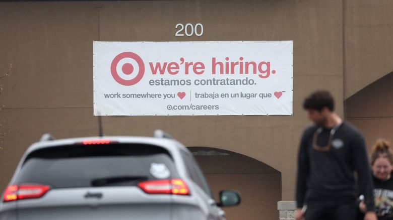NOVATO, CALIFORNIA - APRIL 07: People walk by a hiring sign posted on the exterior of a Target store on April 07, 2023 in Novato, California. The U.S. labor market added 236,000 jobs in March bringing the national unemployment rate down to 3.5 percent.