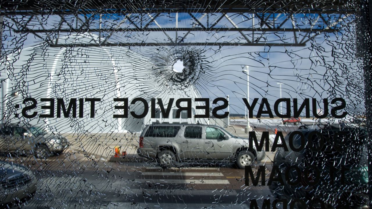 As many as twenty bullet holes riddle the entryway of the New Life church in Colorado Springs, Monday, Dec. 10, 2007, where a day earlier a gunman entered the building. Two are dead in addition to the gunman and another three are injured in the second shooting to hit a Colorado religious organization in a day. The gunman in the Colorado Springs shooting was killed by a church security guard.  (AP Photo/Kevin Moloney, POOL)