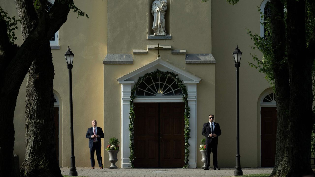 Members of the Secret Service stand guard as US President Joe Biden and First Lady Jill Biden attend a memorial mass at Saint Joseph on the Brandywine Catholic Church on the anniversary of the death of their son Beau Biden, on May 30, 2023, in Wilmington, Delaware. (Photo by Brendan Smialowski / AFP) (Photo by BRENDAN SMIALOWSKI/AFP via Getty Images)