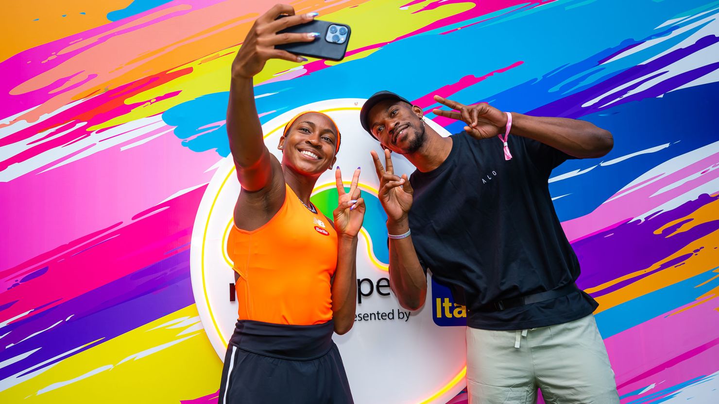 Coco Gauff takes a picture with Jimmy Butler after defeating Rebecca Marino in the second round of the 2023 Miami Open.