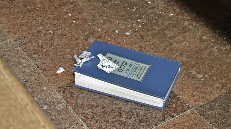 Rabbi Jeffrey Myers testified that a damaged prayer book "tells a story that needs to be told."