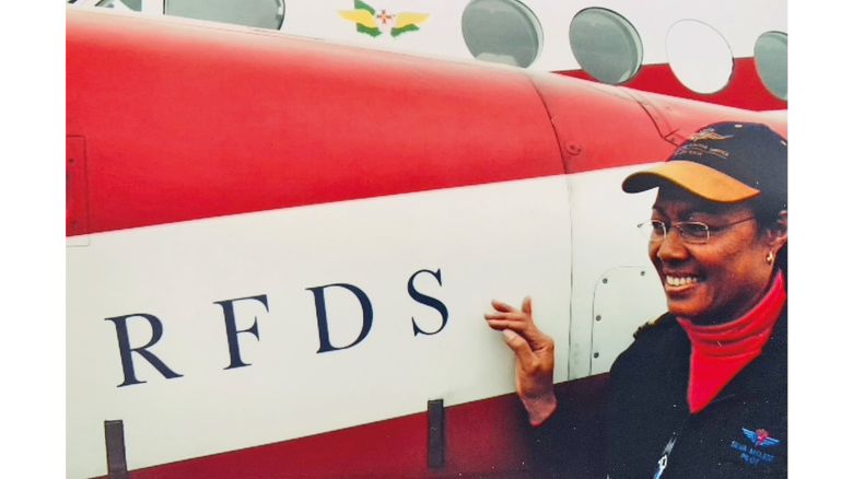 Silva McLeod in front of a Royal Flying Doctor Service plane