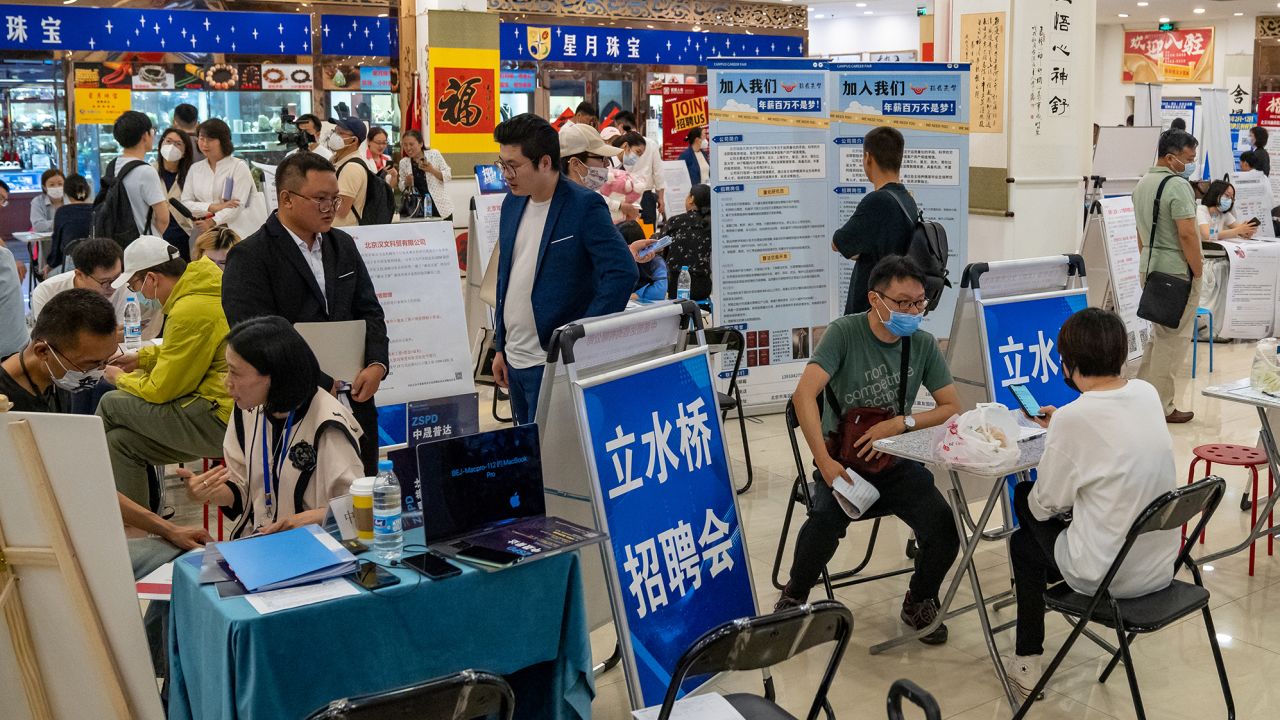 Job seekers and recruiters at a job fair in Beijing, China, on May 26, 2023. 