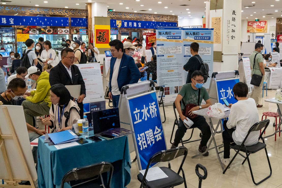 Job seekers and recruiters at a job fair in Beijing, China, on May 26, 2023. 