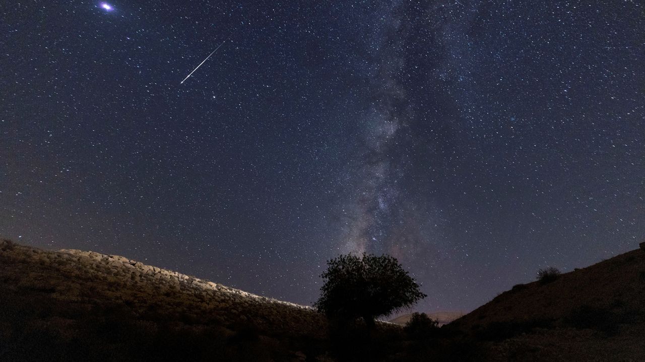 A meteor streaks past stars in the night sky during the annual Perseid meteor shower at the Negev Desert in southern Israel, August 13, 2021. REUTERS/Amir Cohen     TPX IMAGES OF THE DAY