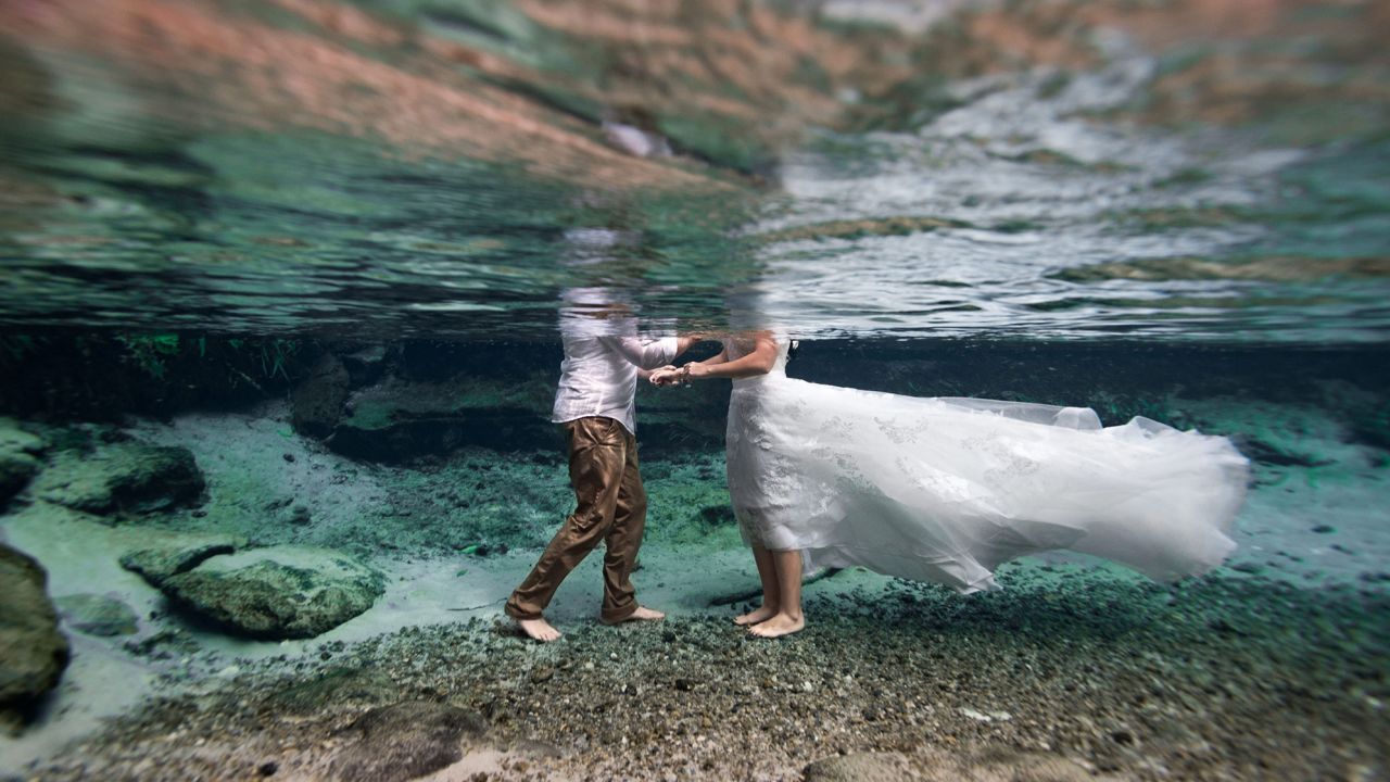 Wedding photographer Kimber Greenwood specializes in underwater weddings and has seen a jump in interest from couples this year.