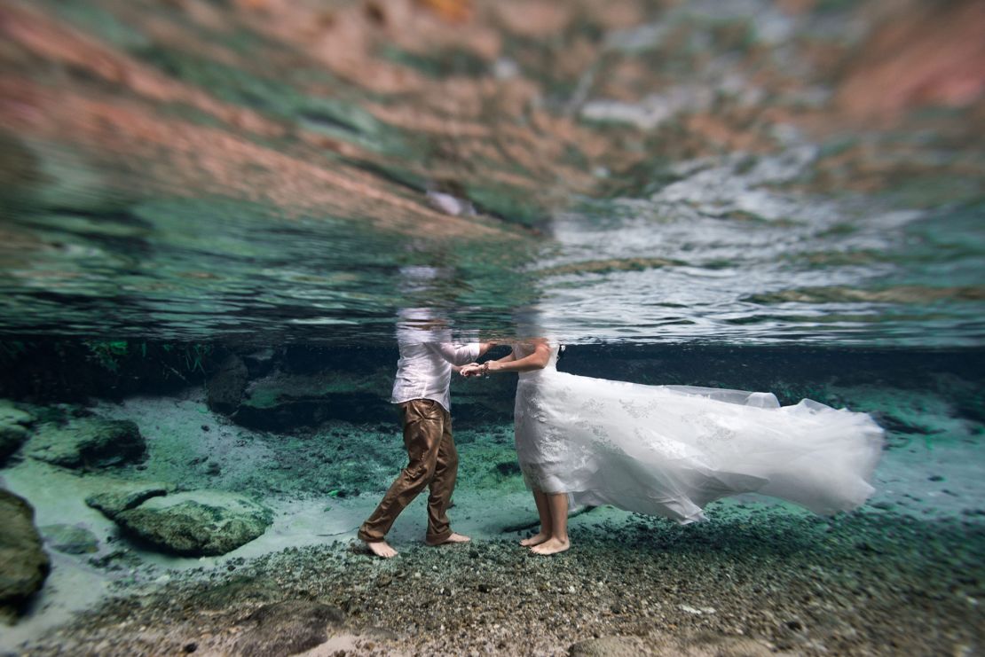 Wedding photographer Kimber Greenwood specializes in underwater weddings and has seen a jump in interest from couples this year.