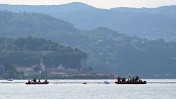 SESTO CALENDE, ITALY - MAY 29: Fire brigade and scuba divers perform recovery operations of the boat on May 29, 2023 in Sesto Calende, Italy. Four people have died after a vessel, described as a houseboat capsized and sank during a sudden storm which whipped up strong waves on Sunday evening on Lake Maggiore in Lisanza. Around 23 tourists and two crew members were on board the boat reportedly celebrating a birthday party. (Photo by Mattia Ozbot/Getty Images)