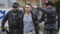 FILE - Solomon Pena, center, a Republican candidate for New Mexico House District 14, is taken into custody by Albuquerque Police officers, Jan. 16, 2023, in southwest Albuquerque, N.M. Peña overwhelmingly lost a bid last fall for the New Mexico statehouse as a Republican and is accused of paying four men to sho