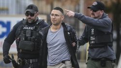 FILE - Solomon Pena, center, a Republican candidate for New Mexico House District 14, is taken into custody by Albuquerque Police officers, Jan. 16, 2023, in southwest Albuquerque, N.M. Peña overwhelmingly lost a bid last fall for the New Mexico statehouse as a Republican and is accused of paying four men to shoot at the homes of four Democratic officials. (Roberto E. Rosales/The Albuquerque Journal via AP, File)