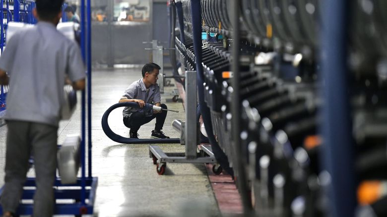 FUZHOU, CHINA - MAY 31: Employees work at an intelligent workshop of chemical fiber and textile enterprise on May 31, 2023 in Fuzhou, Fujian Province of China. (Photo by Zhang Bin/China News Service/VCG via Getty Images)