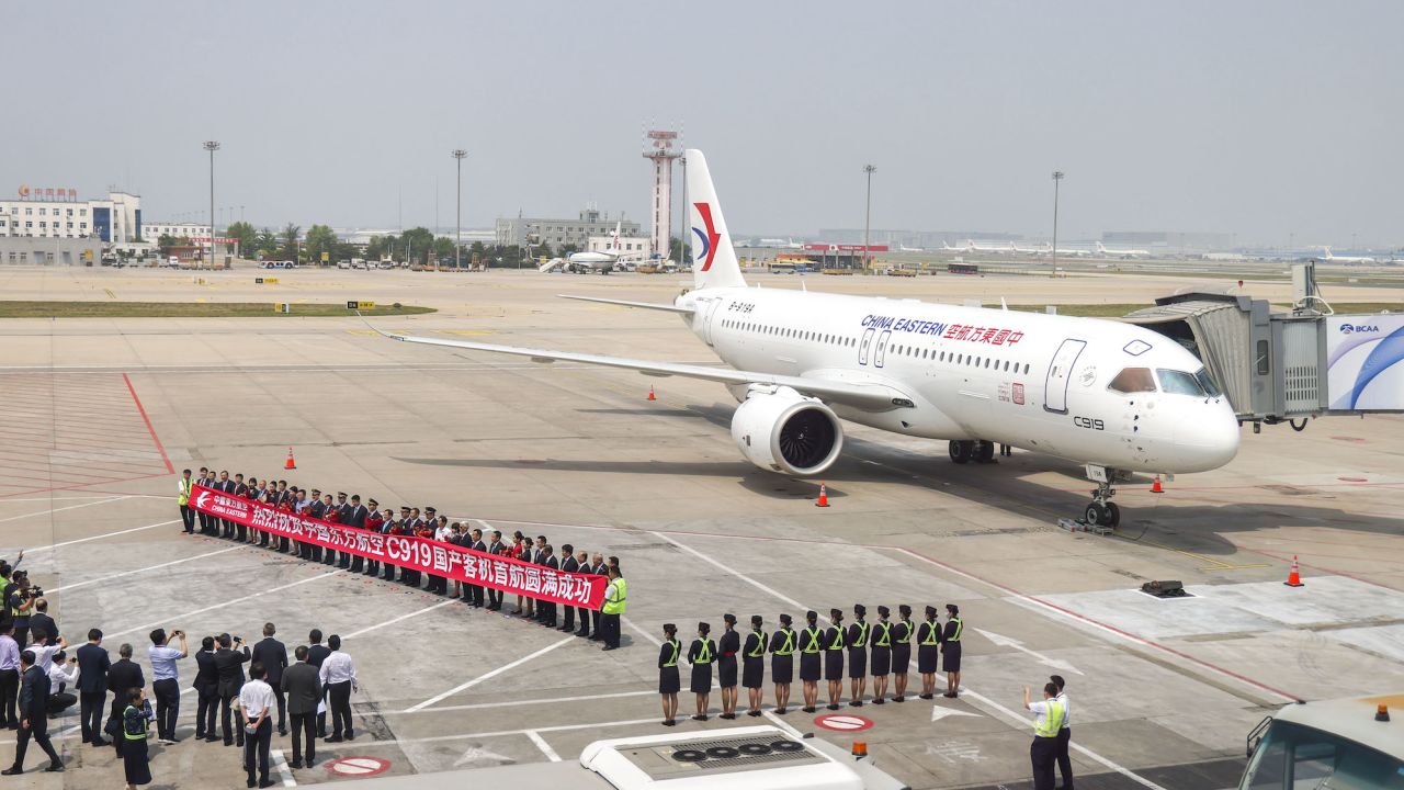 The C919 passenger jet being welcomed on landing in Beijing on Sunday.