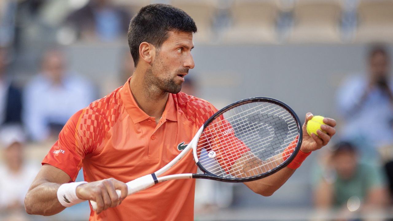 Djokovic prepares to serve against Márton Fucsovics in the French Open second round. 