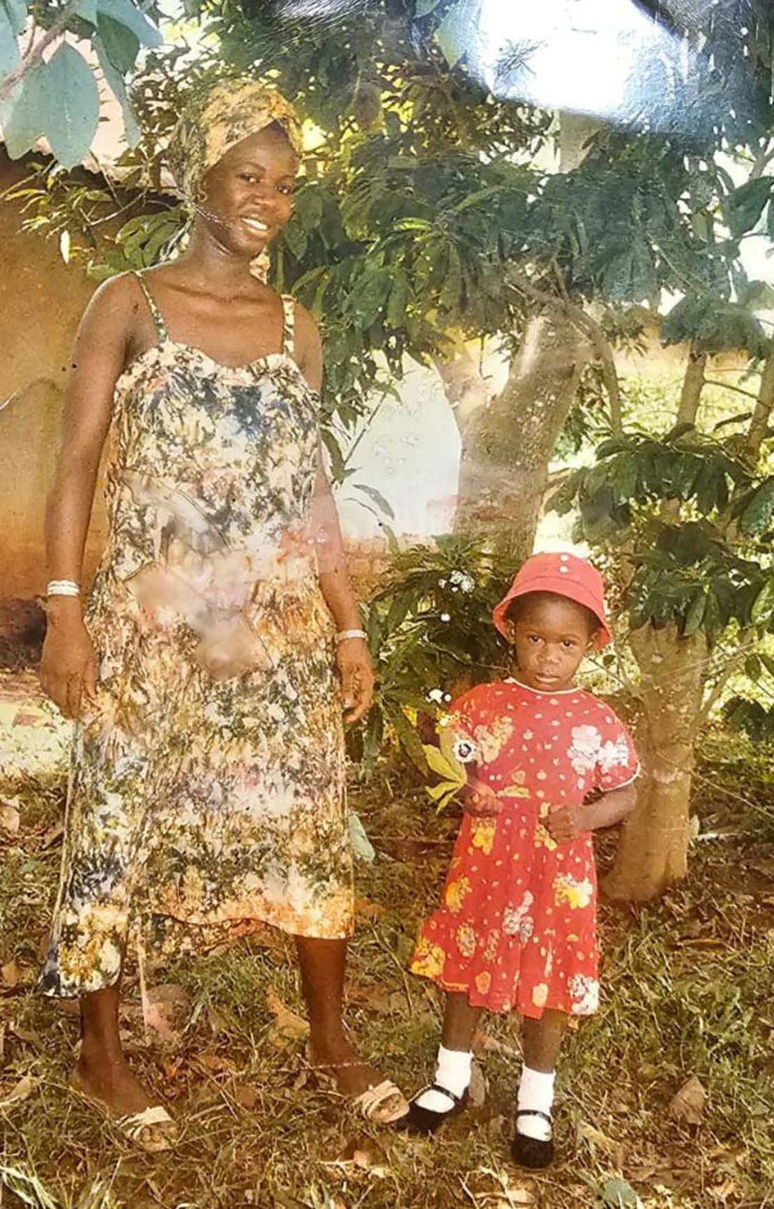 This family photo taken in Liberia shows Faith Akovi Cooper, right, and her mother, Abena Clement. Cooper says all the mementos from her childhood were lost when her home was destroyed during Liberia's civil war, but a family member gave her this photo shortly after she arrived in the United States. 