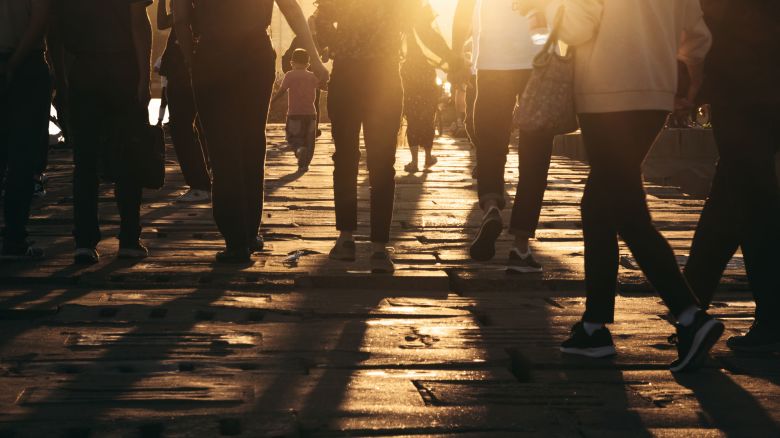 pedestrians at sunset STOCK