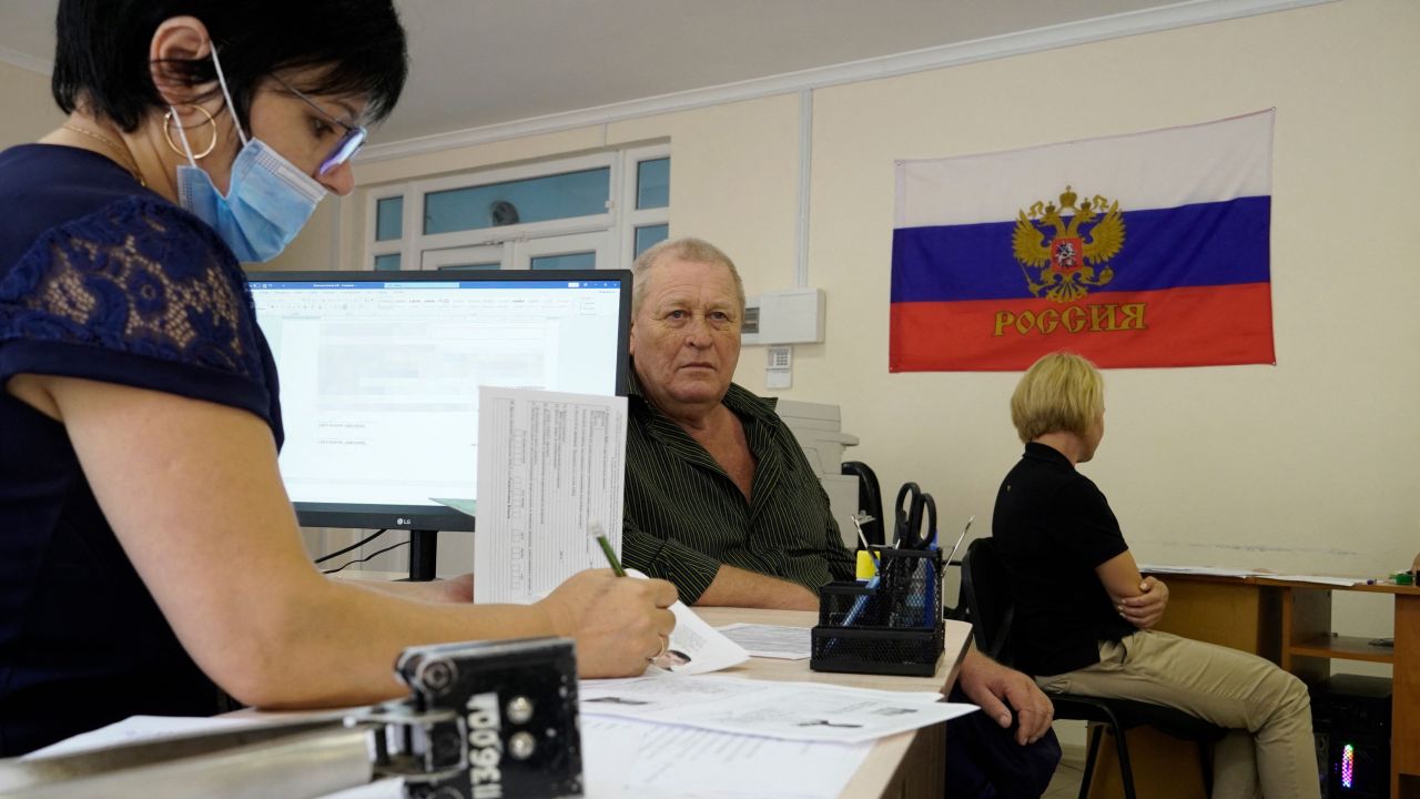 In this file photo, Russian passports are being issued to residents in the occupied city of Melitopol.