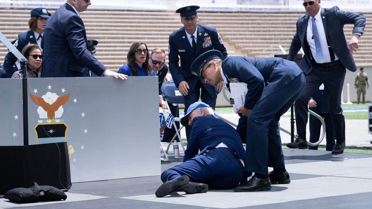 US President Joe Biden is helped up after he <a href="https://www.cnn.com/2023/06/01/politics/biden-us-air-force-academy-trip/index.html" target="_blank">tripped on a sandbag and fell</a> as he completed handing out diplomas at the US Air Force Academy in Colorado Springs, Colorado, on Thursday, June 1. Biden appeared fine afterward, walking without assistance to his seat in the stands. He was seen smiling and jogging toward his vehicle at the ceremony's conclusion.