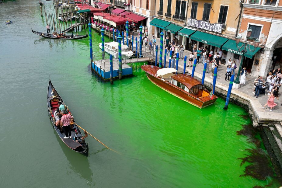 A gondola navigates the Grand Canal in Venice, Italy, near a mysterious patch of <a href="https://www.cnn.com/2023/05/30/europe/venice-grand-canal-fluorescent-green-intl/index.html" target="_blank">fluorescent green water</a> on Sunday, May 28. Environmental authorities said the patch was caused by a nontoxic chemical commonly used in underwater construction to help identify leaks. It was unclear how the substance ended up in the canal, but the Regional Agency for the Environment in Venice said the volume released was unlikely to be an accident.