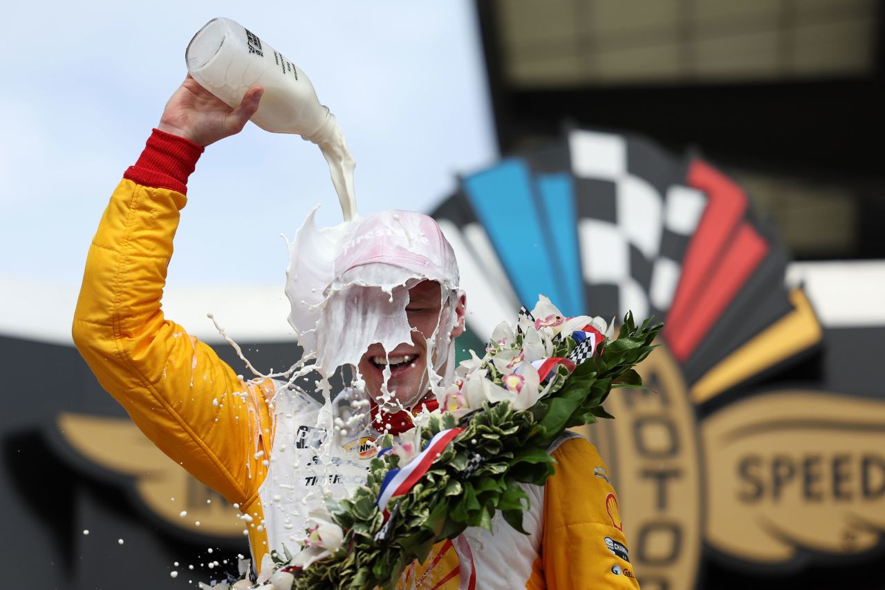 Josef Newgarden pours milk on his head after <a href="https://www.cnn.com/2023/05/28/sport/josef-newgarden-indy-500-winner/index.html" target="_blank">winning the Indianapolis 500</a> on Sunday, May 28. Celebrating with milk is tradition for the driver who wins the historic race.