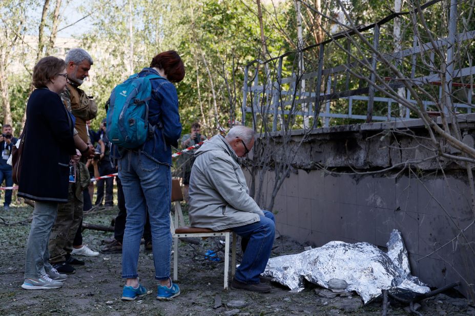A man <a href="https://www.cnn.com/2023/06/01/europe/kyiv-three-killed-closed-bomb-shelter-intl-ukr/index.html" target="_blank">sits next to the body of his dead granddaughter</a> after a Russian strike in Kyiv, Ukraine, on Thursday, June 1. Falling debris killed the girl, her 34-year-old mother and a 33-year-old woman, according to the national police.