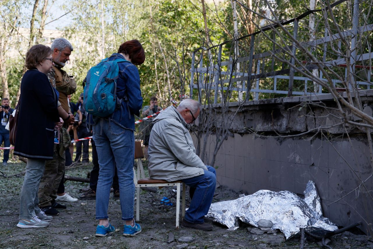 A man <a href="https://www.cnn.com/2023/06/01/europe/kyiv-three-killed-closed-bomb-shelter-intl-ukr/index.html" target="_blank">sits next to the body of his dead granddaughter</a> after a Russian strike in Kyiv, Ukraine, on Thursday, June 1. Falling debris killed the girl, her 34-year-old mother and a 33-year-old woman, according to the national police.