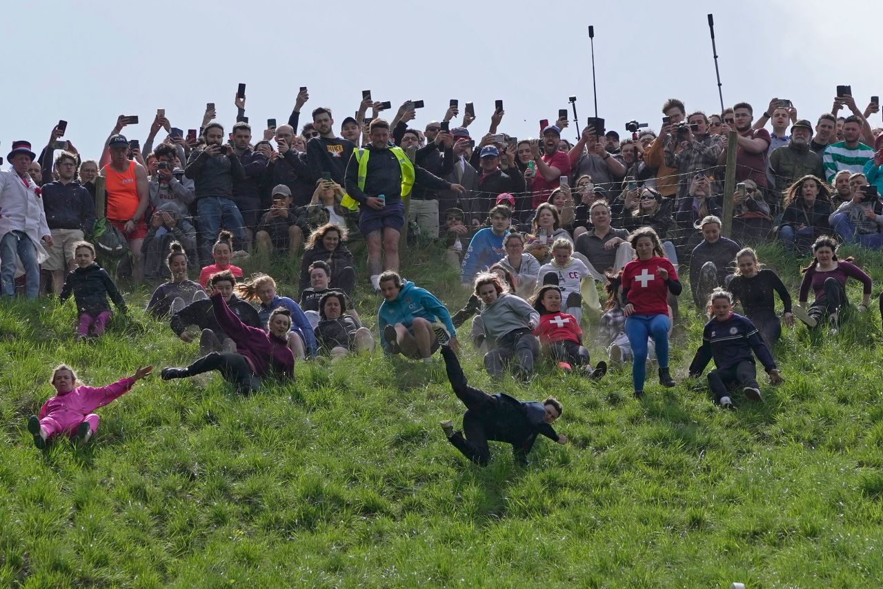 Women compete Monday, May 29, in the annual cheese-rolling races at Cooper's Hill in Brockworth, England. In the races, which date to the early 1800s, runners chase cheese wheels down an extremely steep hill. The first person over the finish line in each race wins the cheese.