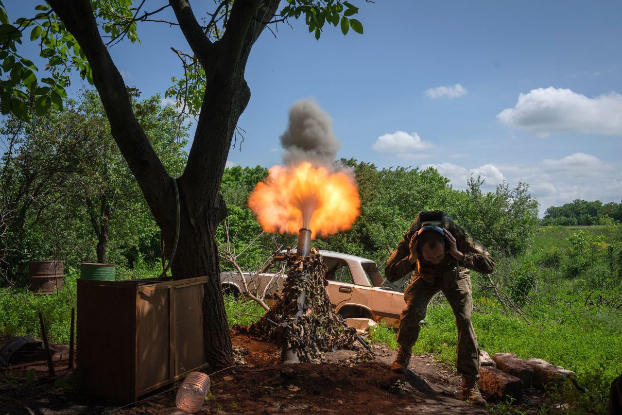 A Ukrainian soldier fires a mortar at Russian positions near Bakhmut, Ukraine, on Monday, May 29.