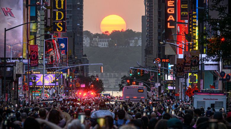 The Sun sets in alignment with Manhattan streets running east-west, also known as Manhattanhenge, in New York City on May 30, 2023. Manhattanhenge occurs about the same two days in May and then again on two days in July every year. (Photo by Ed JONES / AFP) (Photo by ED JONES/AFP via Getty Images)
