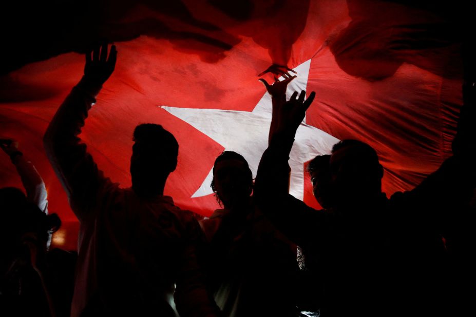 Supporters of Turkish President Recep Tayyip Erdogan react on the day he won an election runoff on Sunday, May 28.