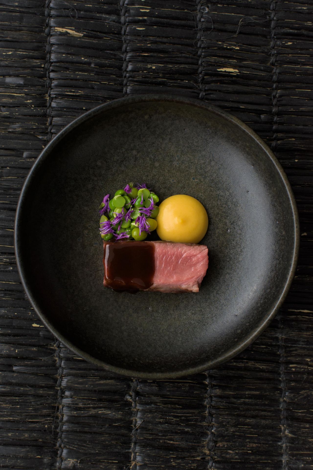 Inspired by Malonga's Congolese heritage, this dish highlights palm oil, a signature Congolese product, pureed with sweet potato, and served alongside Rwandan beef.