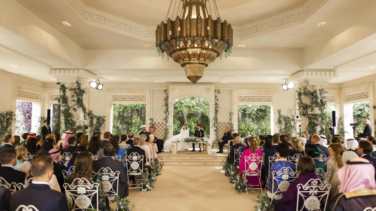 Jordan's Crown Prince Hussein and Rajwa Alseif sit during the wedding ceremony in Amman, Jordan on Thursday.