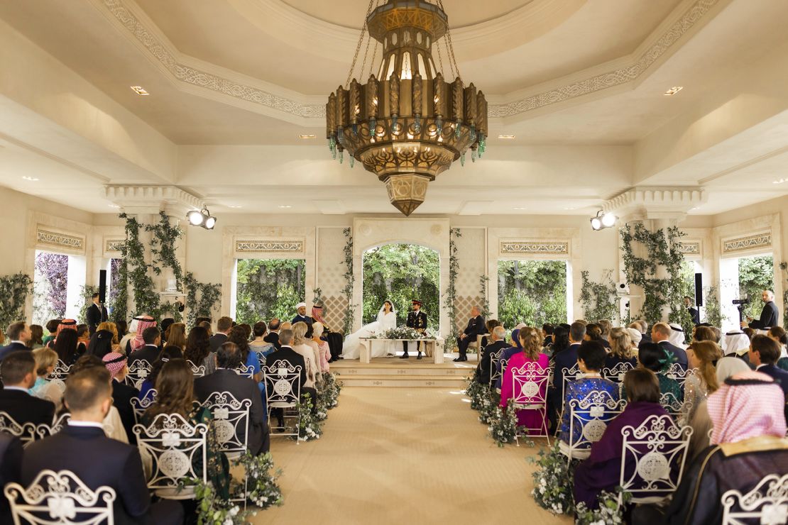 Jordan's Crown Prince Hussein and Rajwa Alseif sit during the wedding ceremony in Amman, Jordan on Thursday.