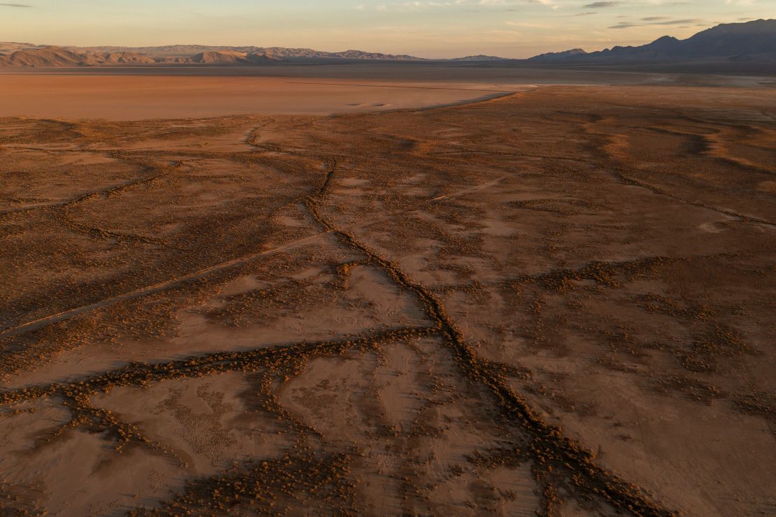 Giant so-called desiccation cracks are seen north of Kingman in northwest Arizona. These cracks form as underground water that supports the land is depleted.