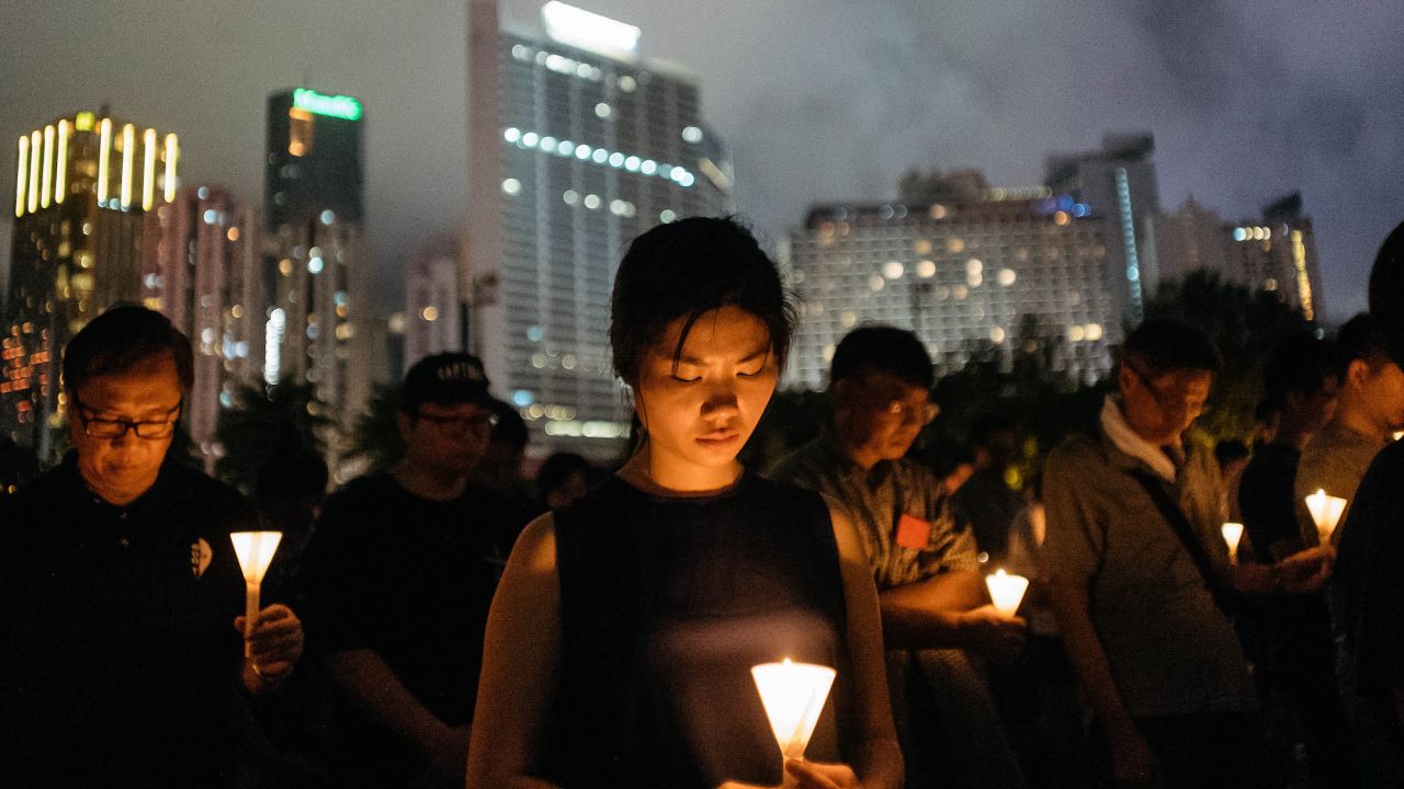 Participants take part at the candlelight vigil as they hold candles at Victoria Park on June 4, 2017 in Hong Kong.