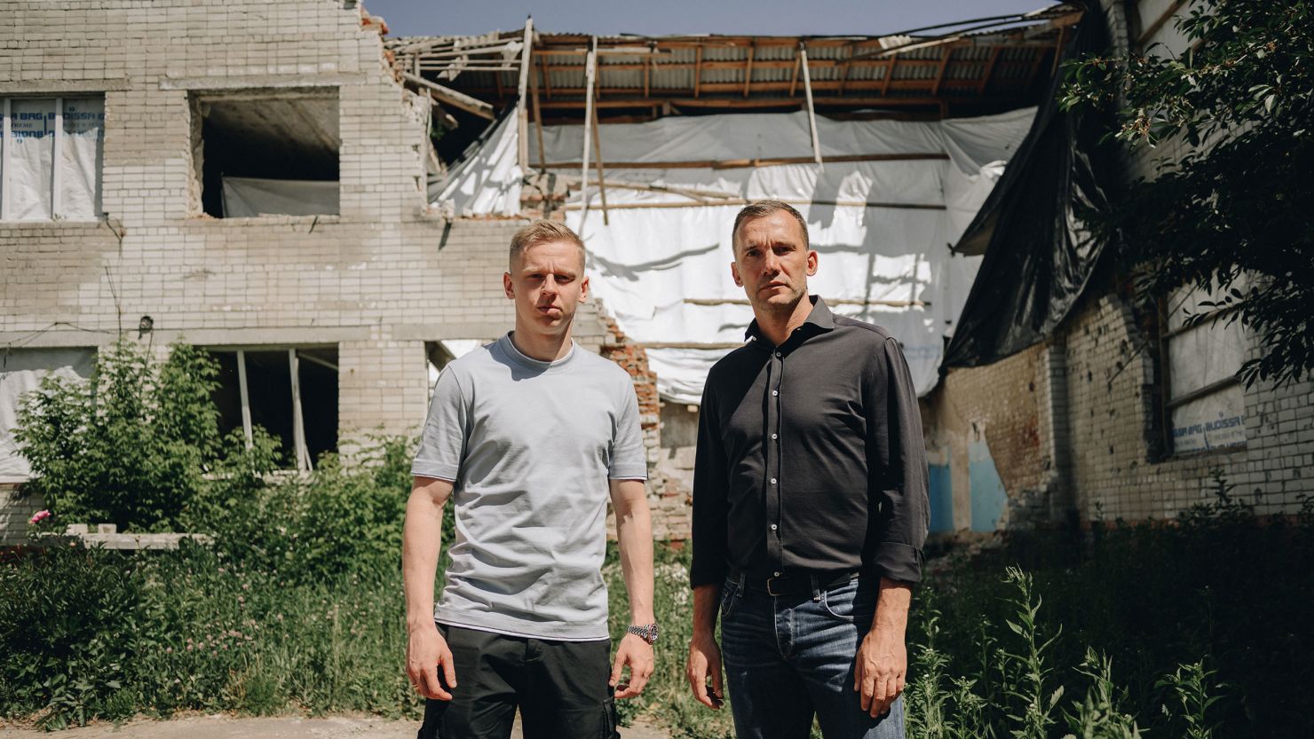 Oleksandr Zinchenko and Andriy Shevchenko visit a school in northern Ukraine that was damaged by a Russian missile.