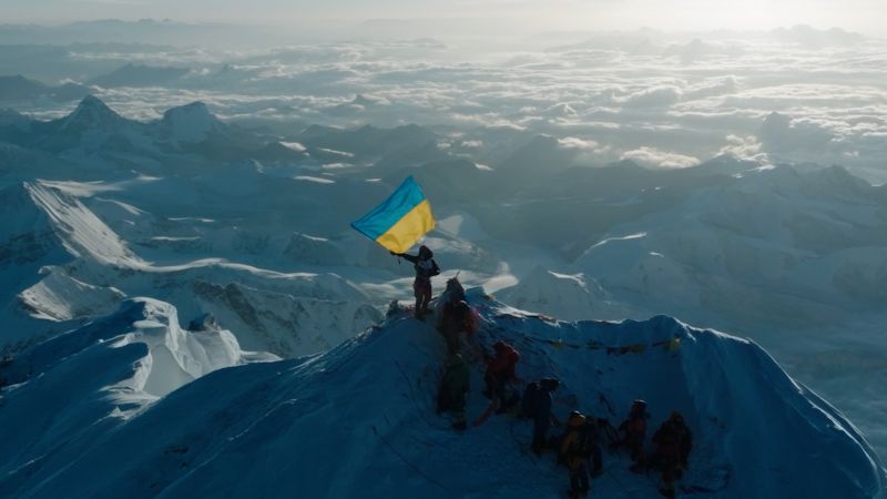 See the moment Ukrainian climber proudly waves flag at the top of Everest | CNN