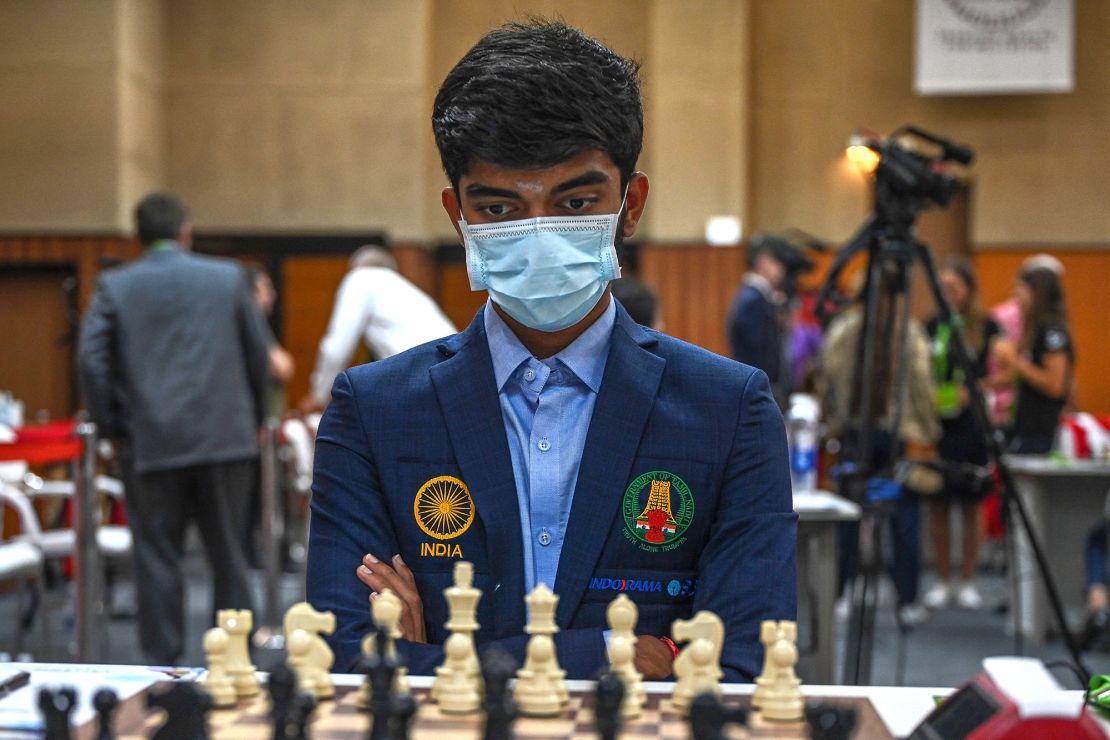 Gukesh surveys the board during his round nine game against the Azerbaijan team at the 44th Chess Olympiad on August 7, 2022.