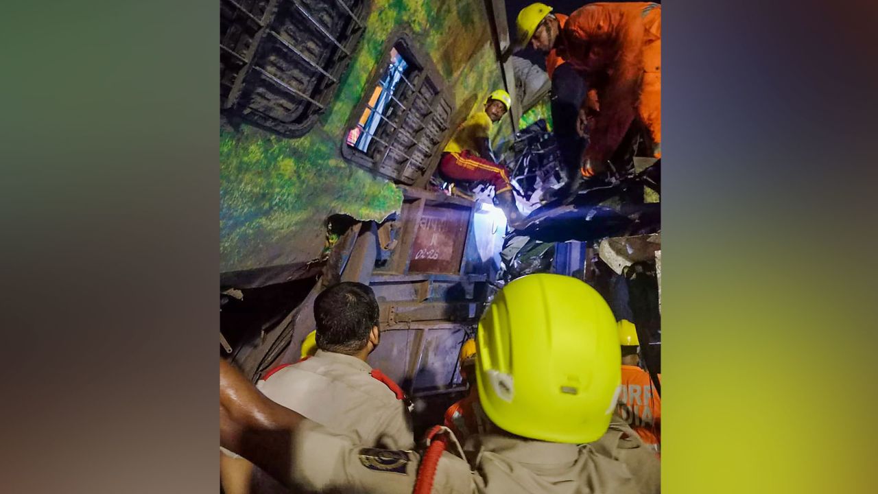 Rescuers scramble to find people in a derailed passanger train in Balasore on June 2, 2023.