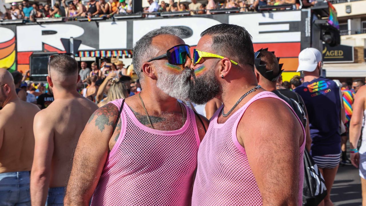 Two men kiss during the Gay Pride Maspalomas 2023, in Playa del Ingles, on May 13 in Maspalomas, Gran Canaria, Canary Islands, Spain. 