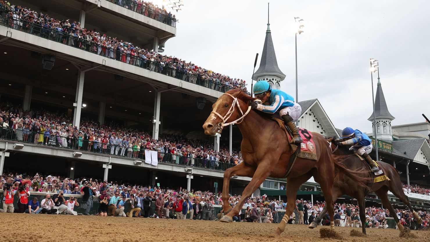 Mage, No. 8, crosses the finish line to win the 149th running of the Kentucky Derby at Churchill Downs on May 06, 2023 in Louisville, Kentucky.