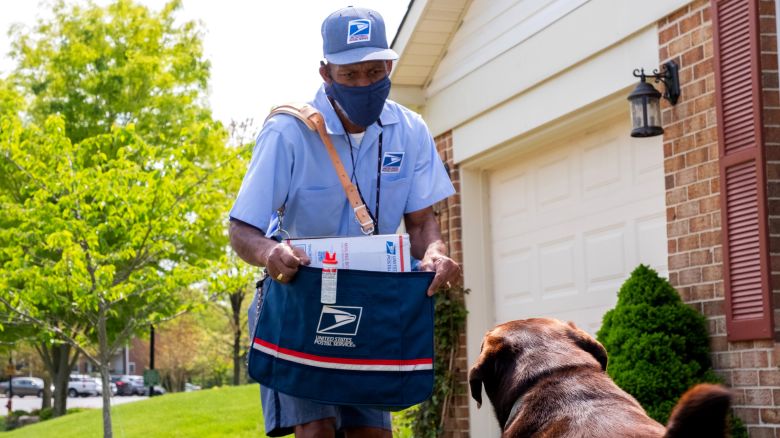 Images of letter carrier delivering to a house with dogs for the dog bite awareness campaign. 