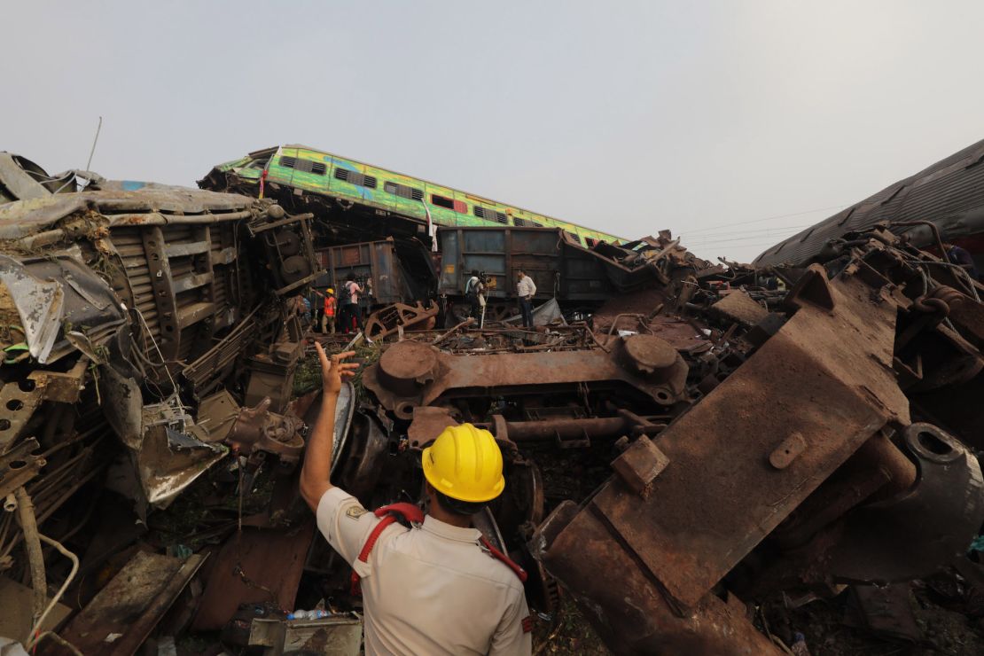 An official overseas rescue efforts at the site of the train crash in Balasore.
