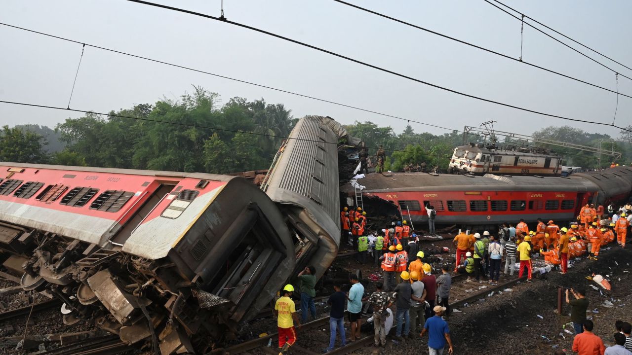 Overturned carriages in the wreckage of the crash involving two passenger trains and a freight train.