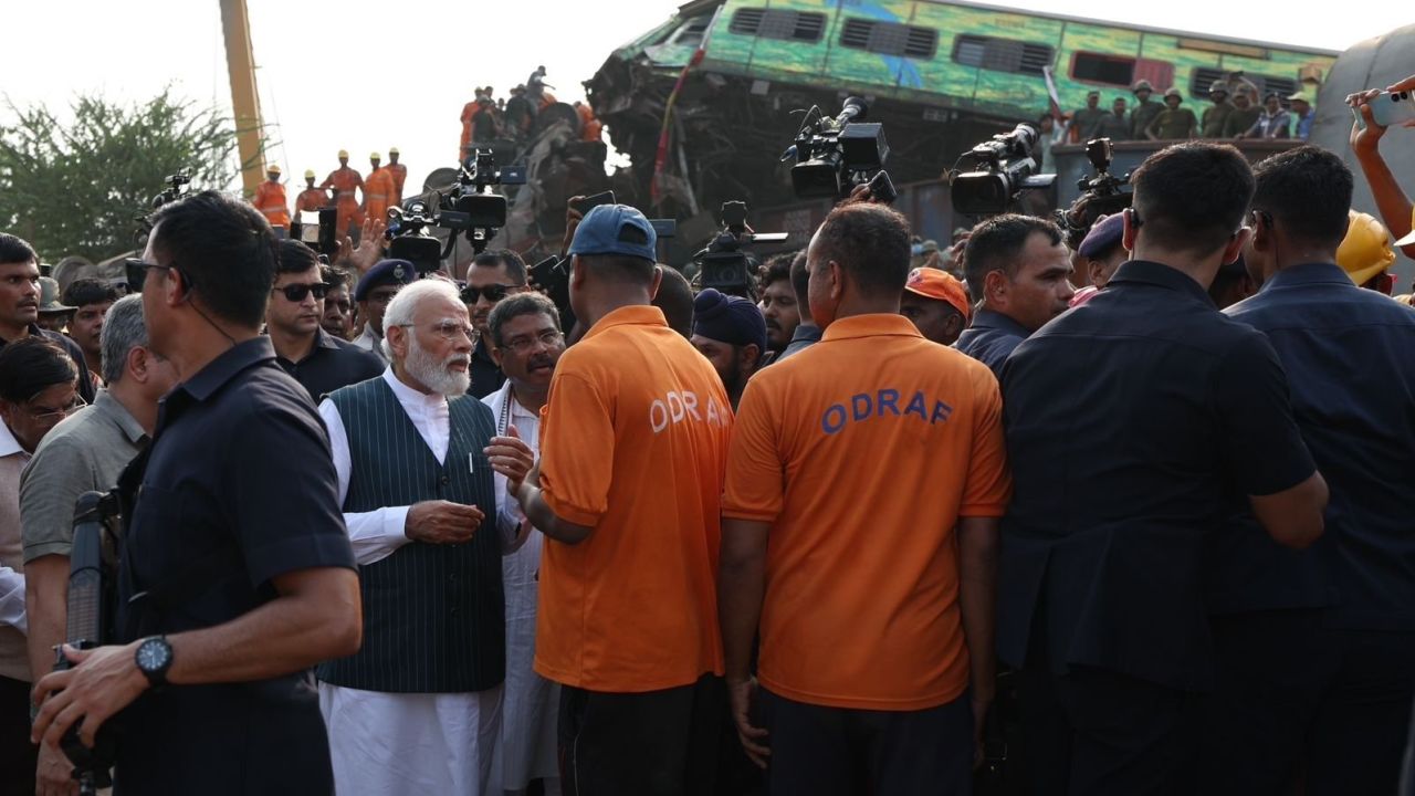 Modi speaks to officials and rescue workers at the site.