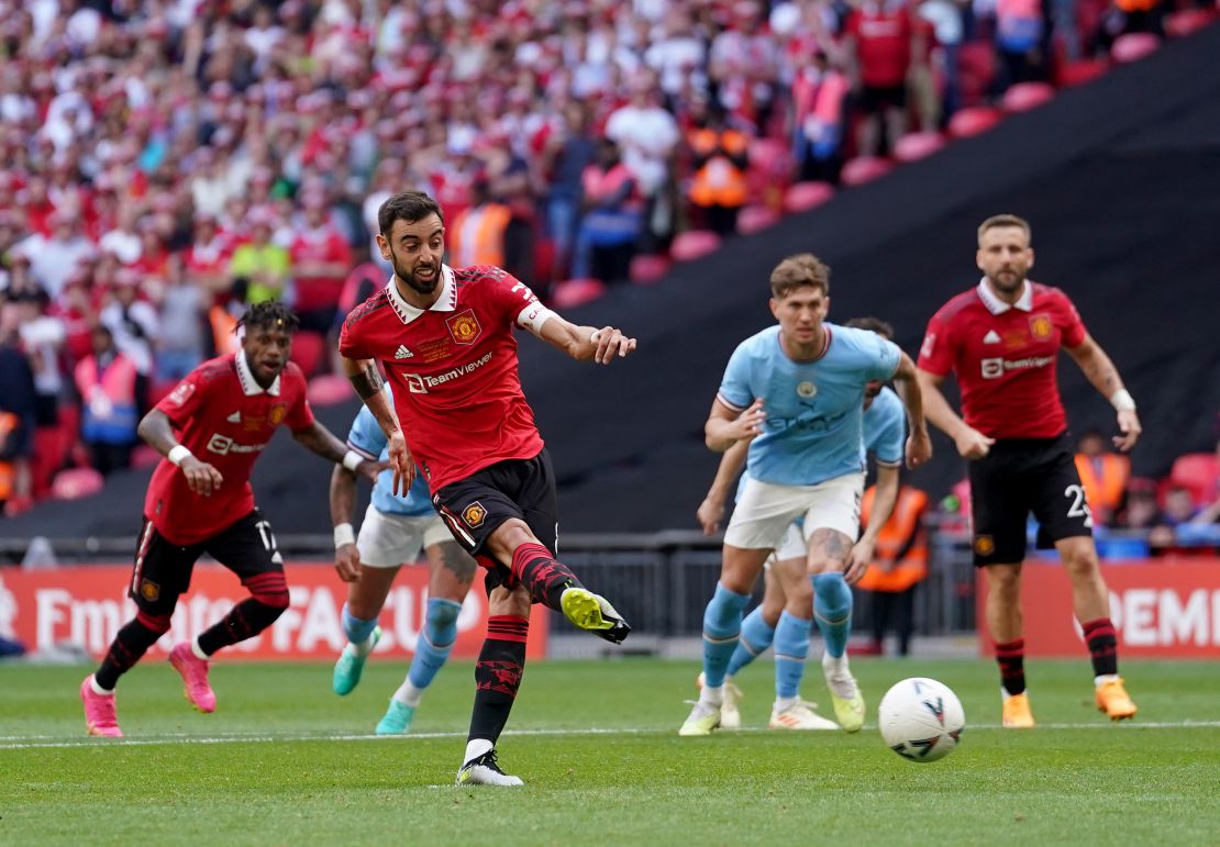 Manchester United's Bruno Fernandes scores from the penalty spot. 