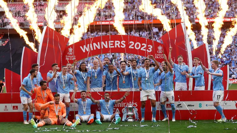 Manchester City's players celebrate winning the FA Cup following the Emirates FA Cup final at Wembley Stadium, London, Saturday June 3, 2023.